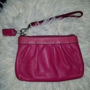 Coach Hot pink leather wristlet.